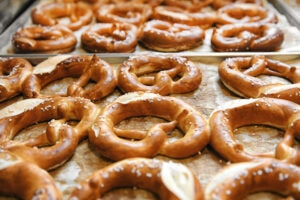 tasty cooked pretzels on trays 2023 11 27 05 22 32 utc